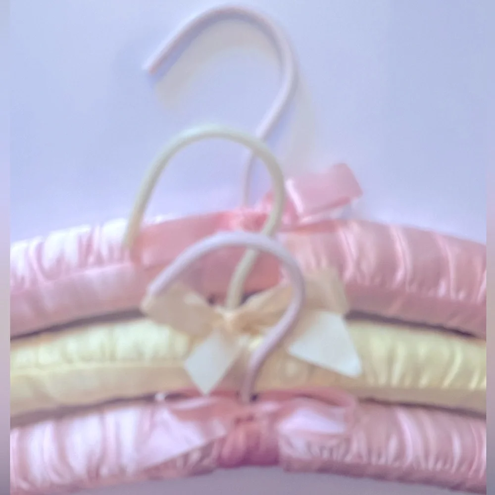 Three Luxurious Padded Satin Hangers-2 Pink and 1 Yellow Hanger.